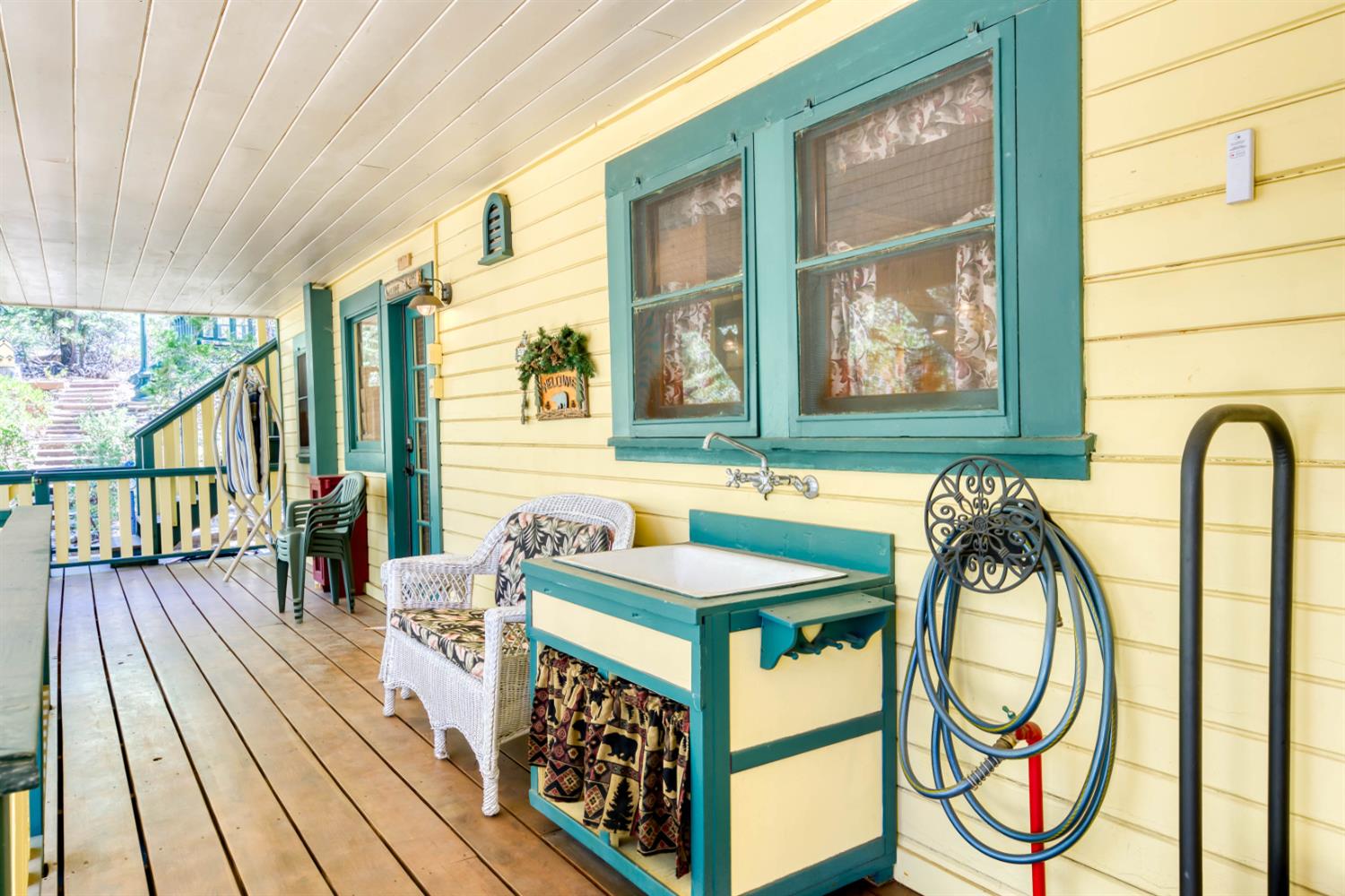 42025 Tollhouse Road Shaver Lake, CA 93664 - Photo 23 of 64 a dinning table and chairs in a balcony