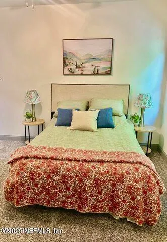 a bedroom with a bed and dresser