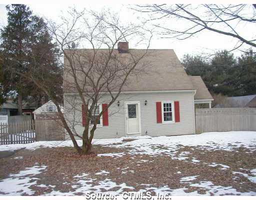 27 Washington Road Cromwell, CT 06416 - Photo 1 of 1 a front view of house with yard and trees