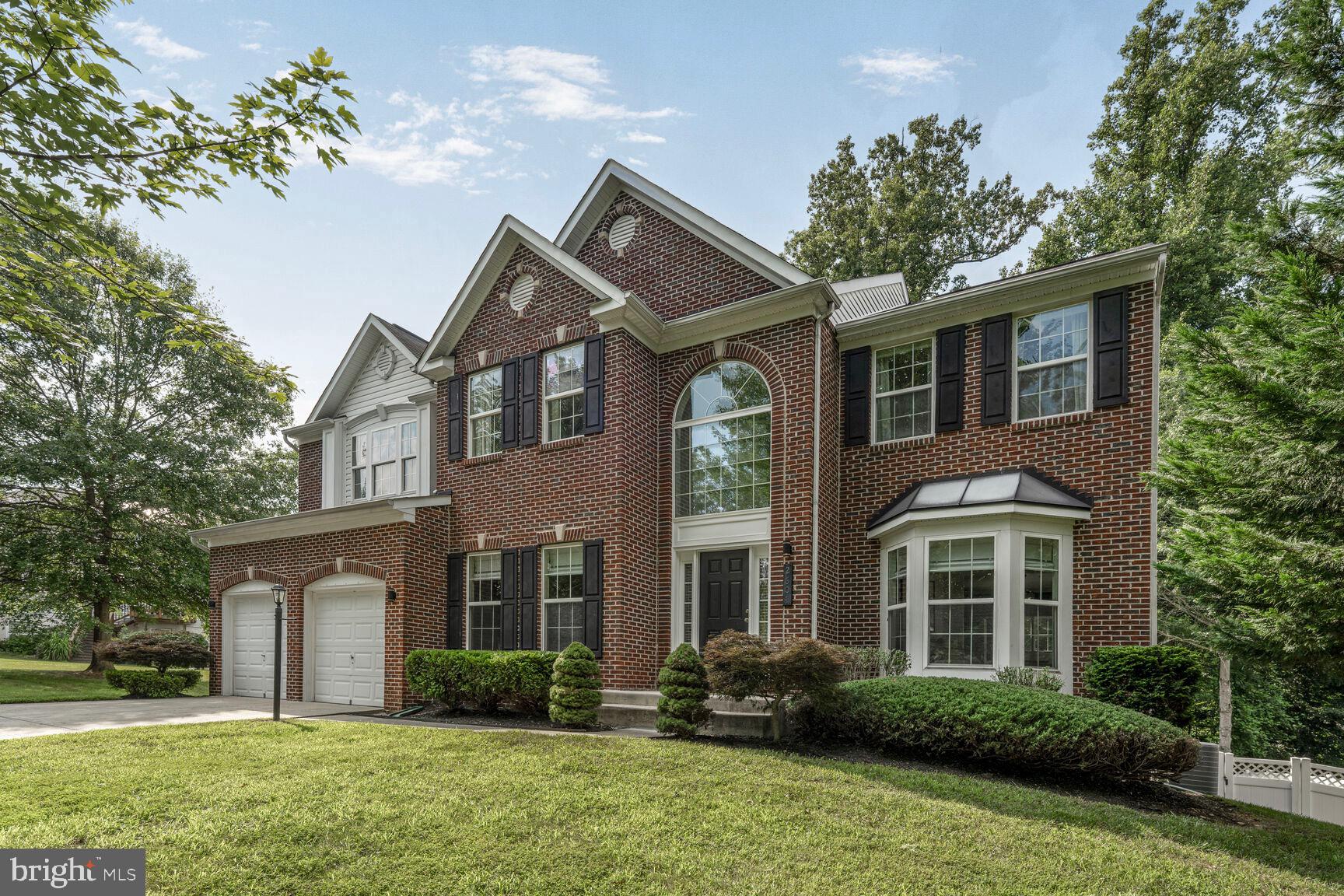 2604 Tree View Way Fort Washington, MD 20744 - Photo 1 of 50 a front view of a house with garden
