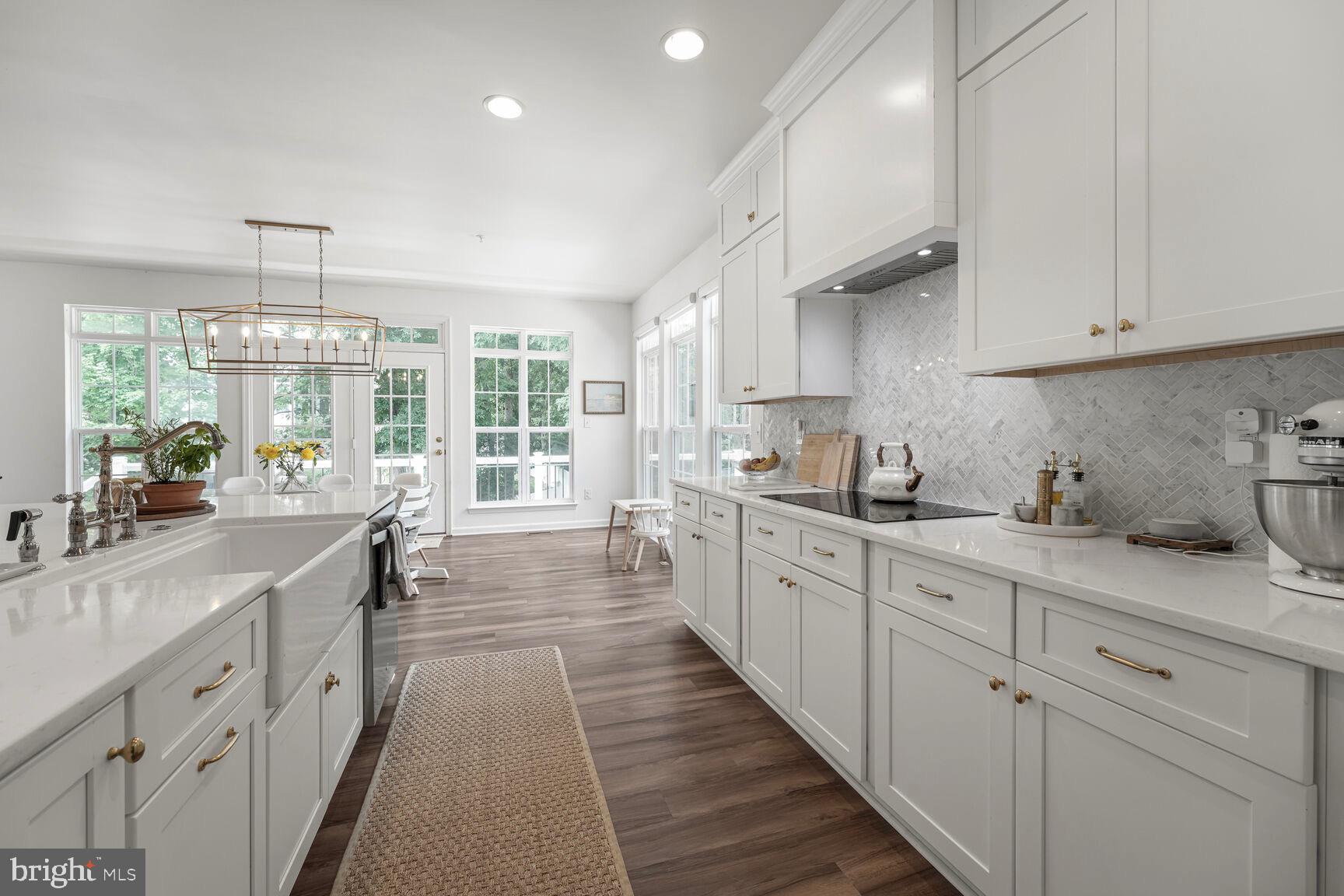 2604 Tree View Way Fort Washington, MD 20744 - Photo 12 of 50 a large kitchen with stainless steel appliances granite countertop a lot of counter space and wooden floors