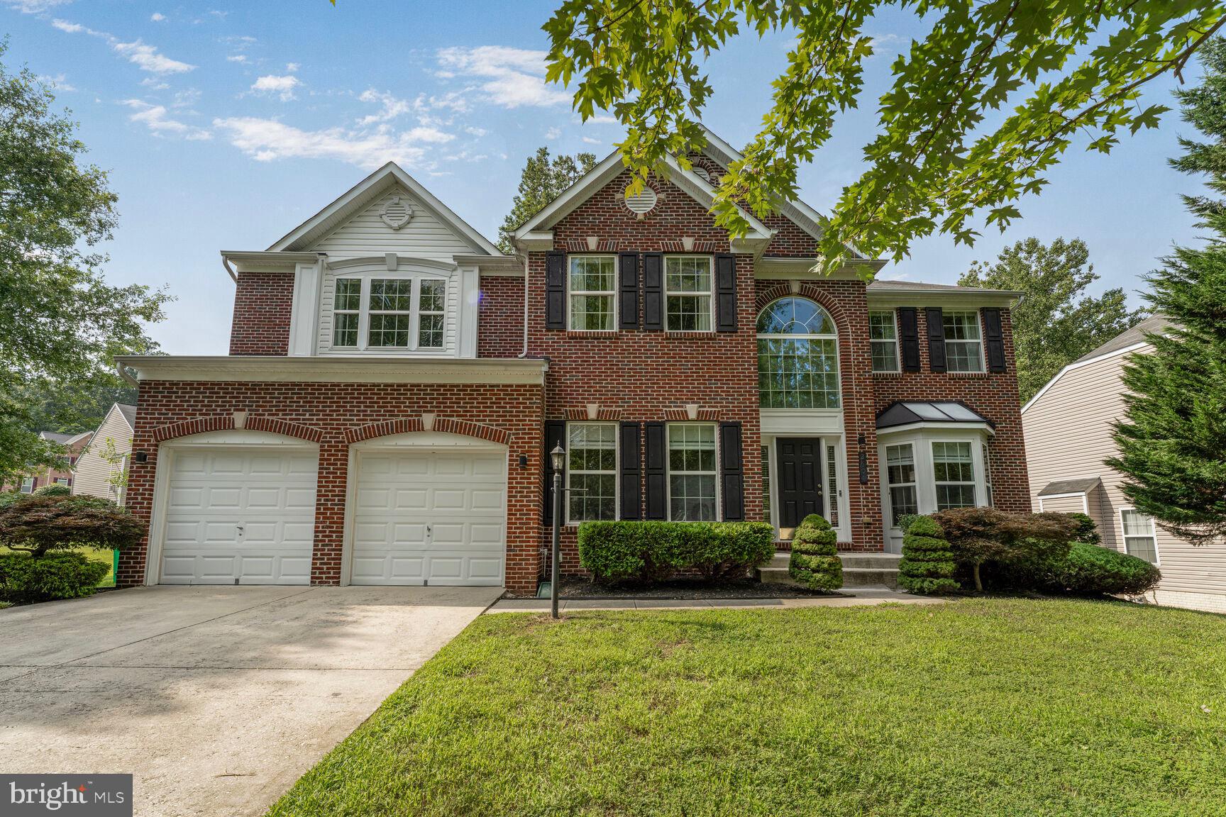 2604 Tree View Way Fort Washington, MD 20744 - Photo 2 of 50 a front view of a house with a garden