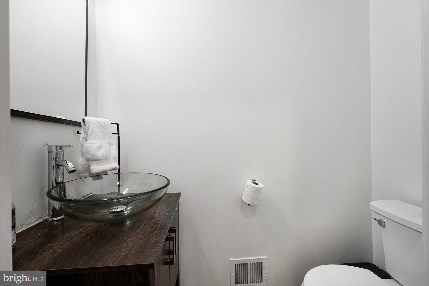 2604 Tree View Way Fort Washington, MD 20744 - Photo 23 of 50 a bathroom with a sink and a toilet