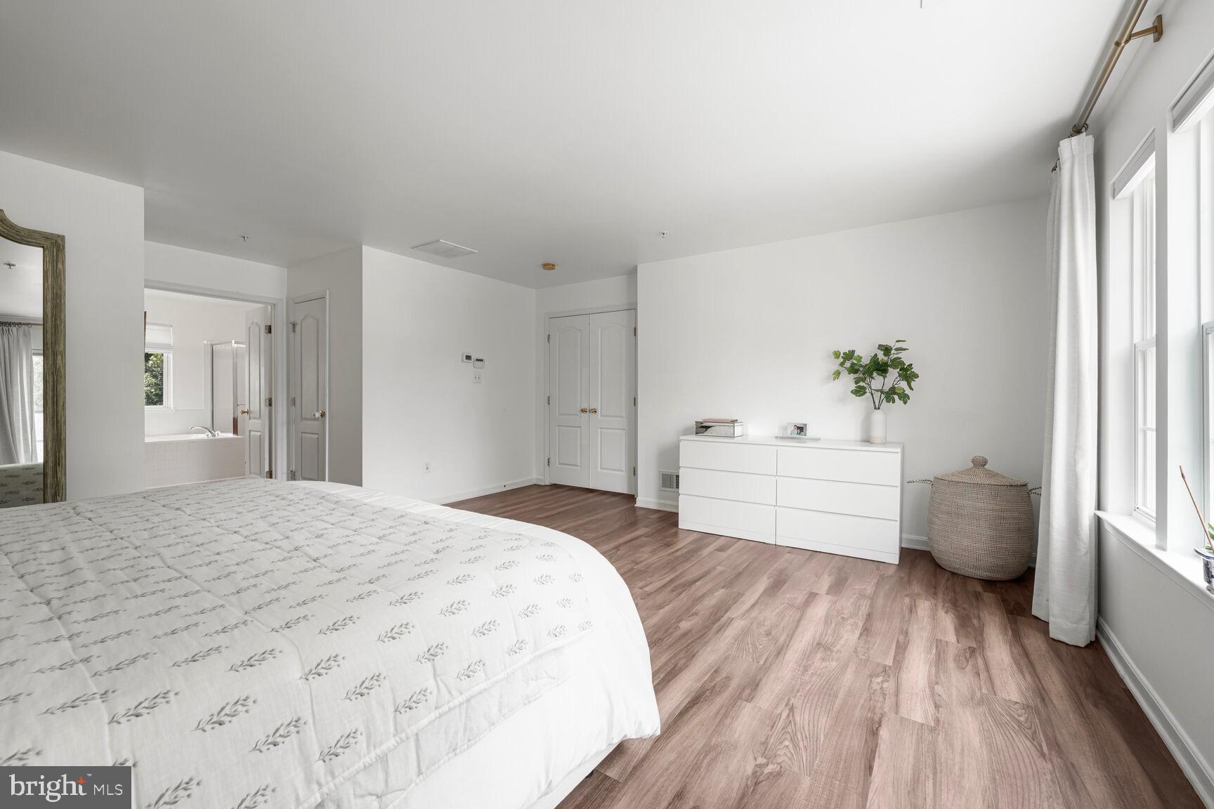 2604 Tree View Way Fort Washington, MD 20744 - Photo 25 of 50 a bedroom with a bed and a large window