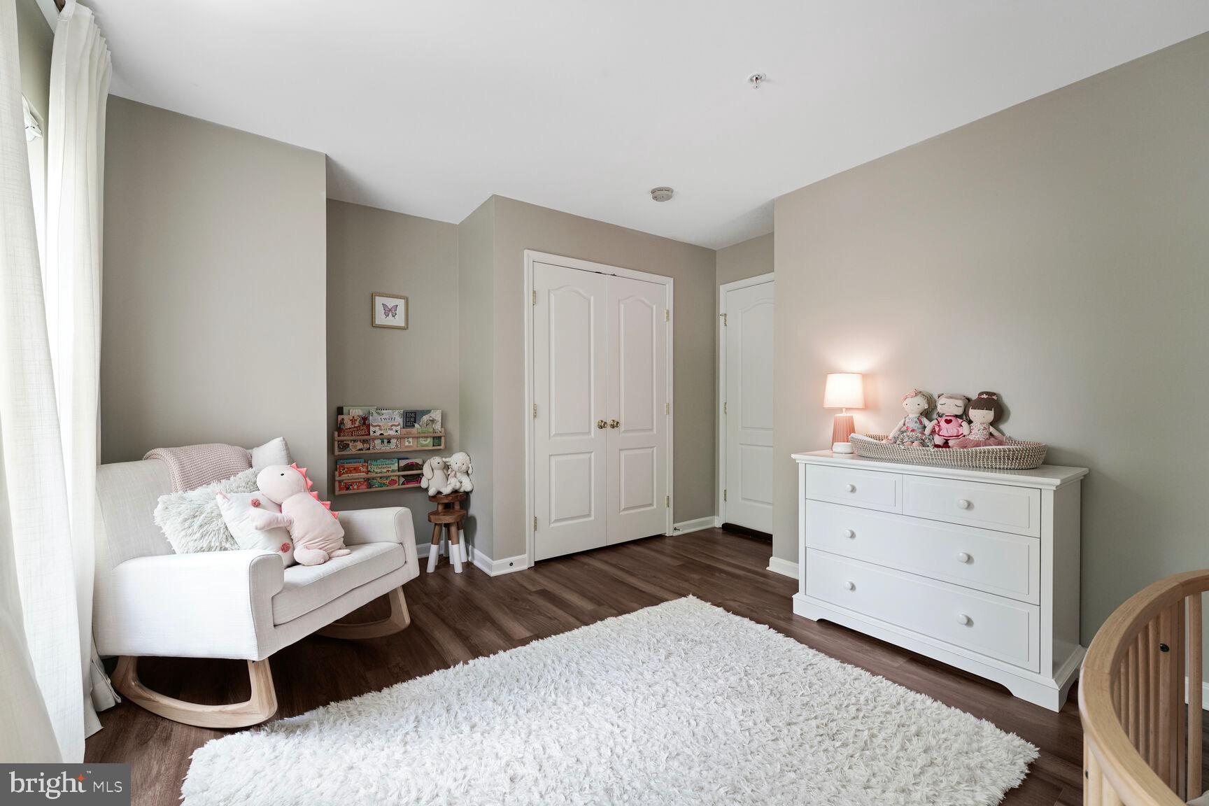 2604 Tree View Way Fort Washington, MD 20744 - Photo 29 of 50 a bedroom with a bed and wooden floor