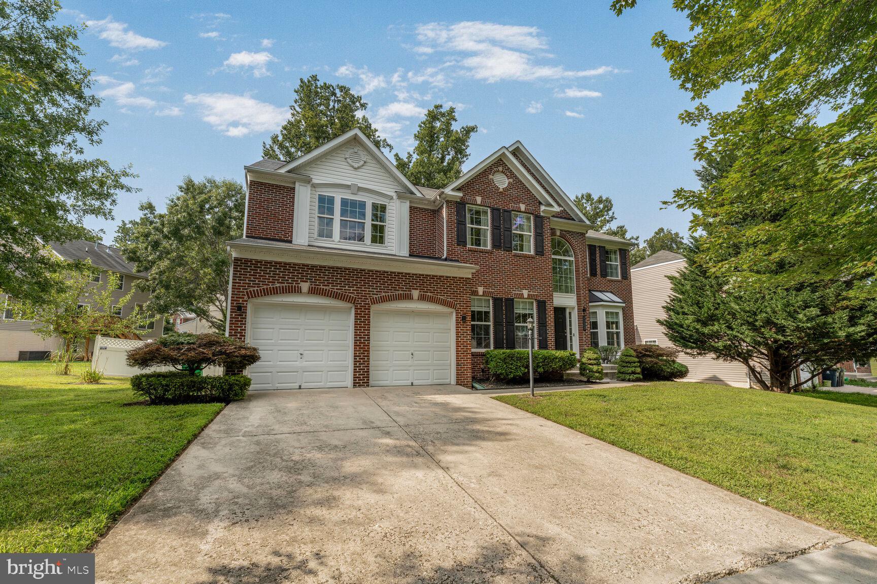 2604 Tree View Way Fort Washington, MD 20744 - Photo 3 of 50 a front view of a house with a yard