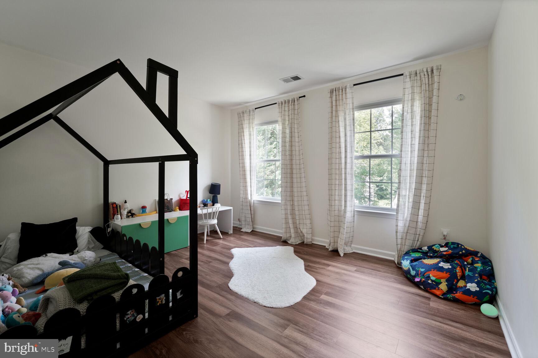 2604 Tree View Way Fort Washington, MD 20744 - Photo 32 of 50 a bedroom with furniture and a window