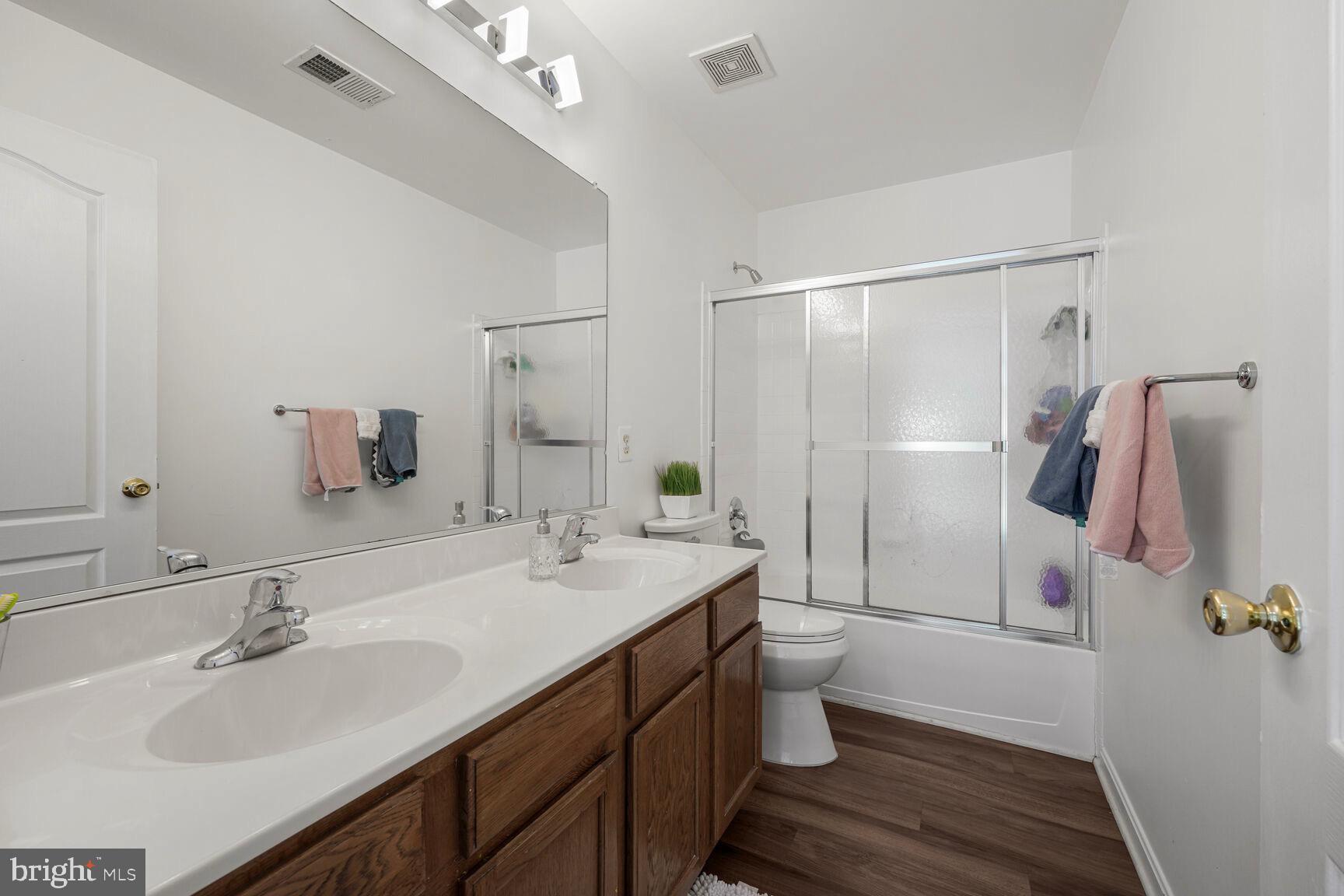 2604 Tree View Way Fort Washington, MD 20744 - Photo 33 of 50 a bathroom with a sink a toilet and shower