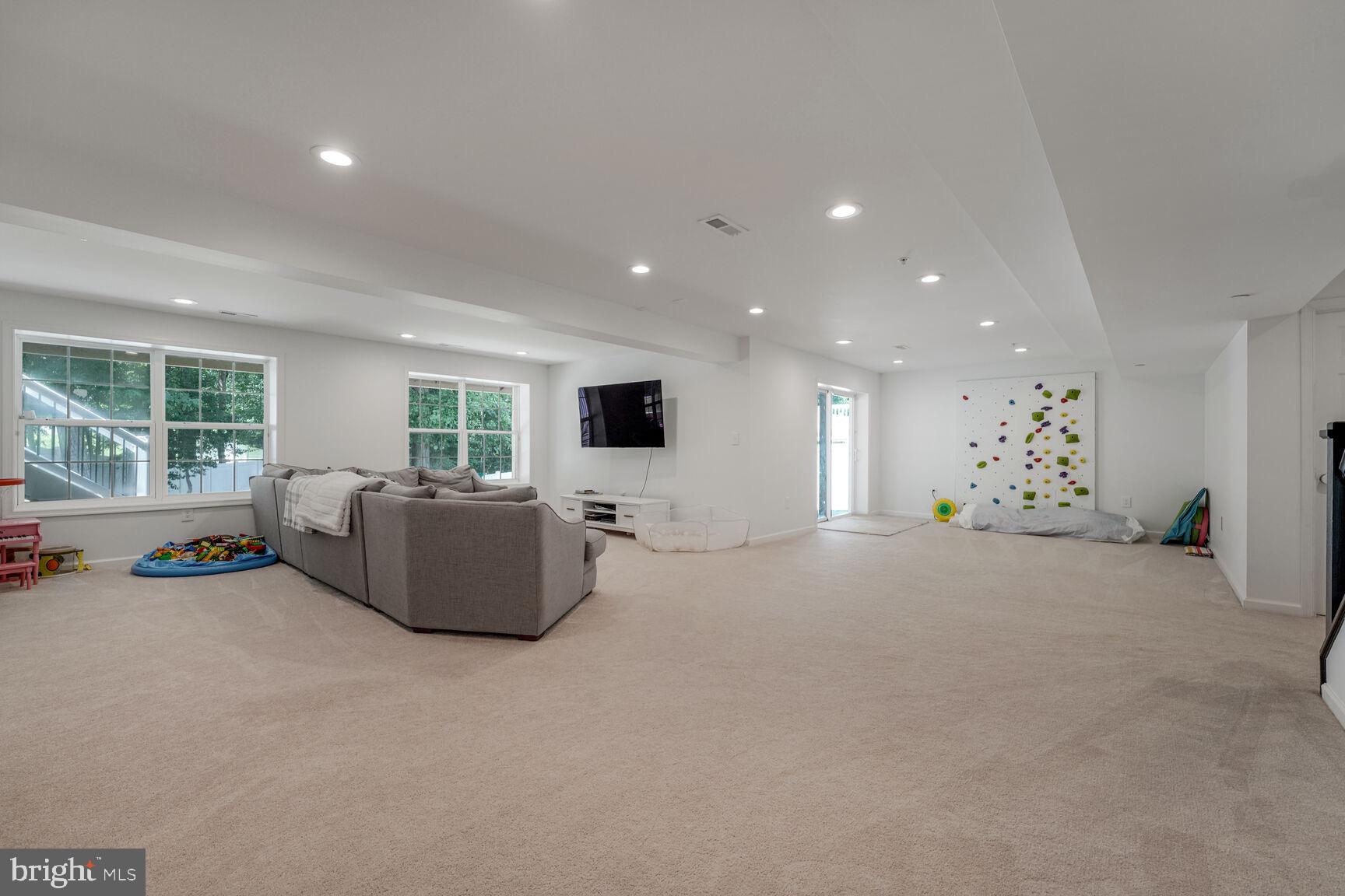 2604 Tree View Way Fort Washington, MD 20744 - Photo 36 of 50 a living room with furniture and a flat screen tv