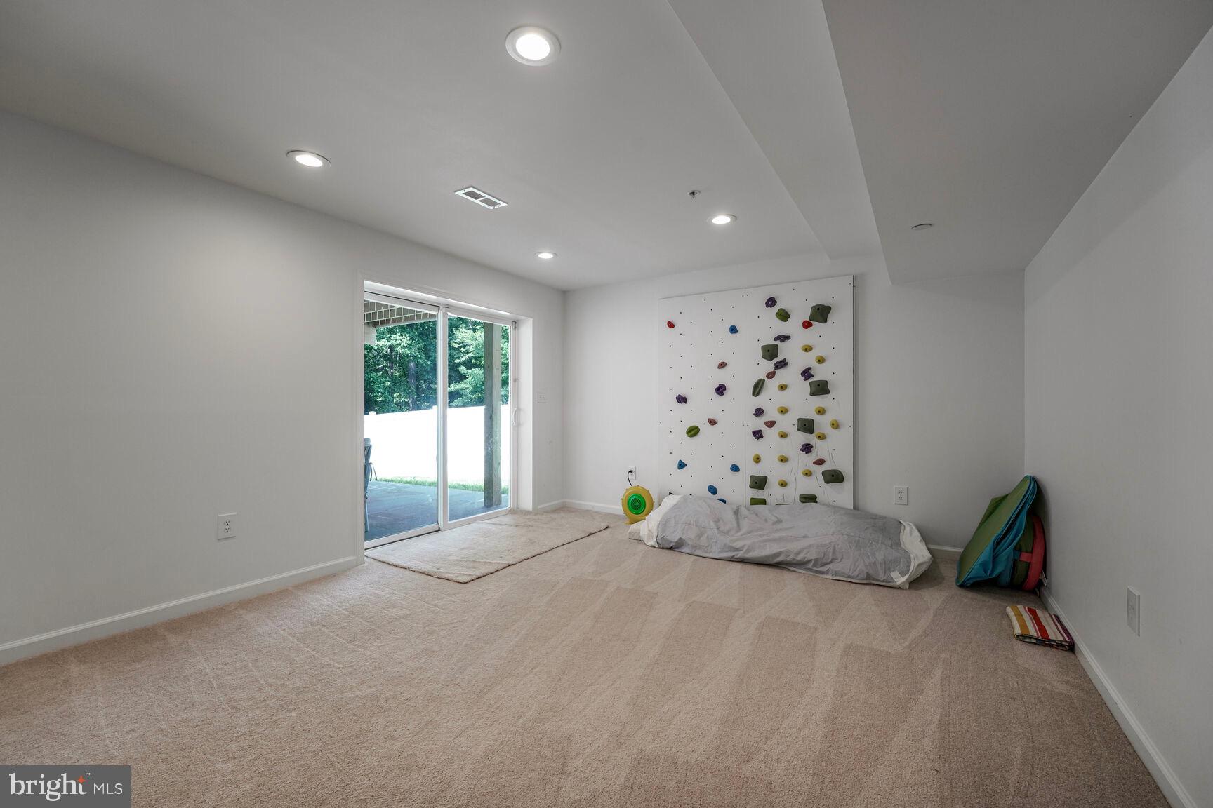 2604 Tree View Way Fort Washington, MD 20744 - Photo 37 of 50 a large bed sitting in a room next to a window