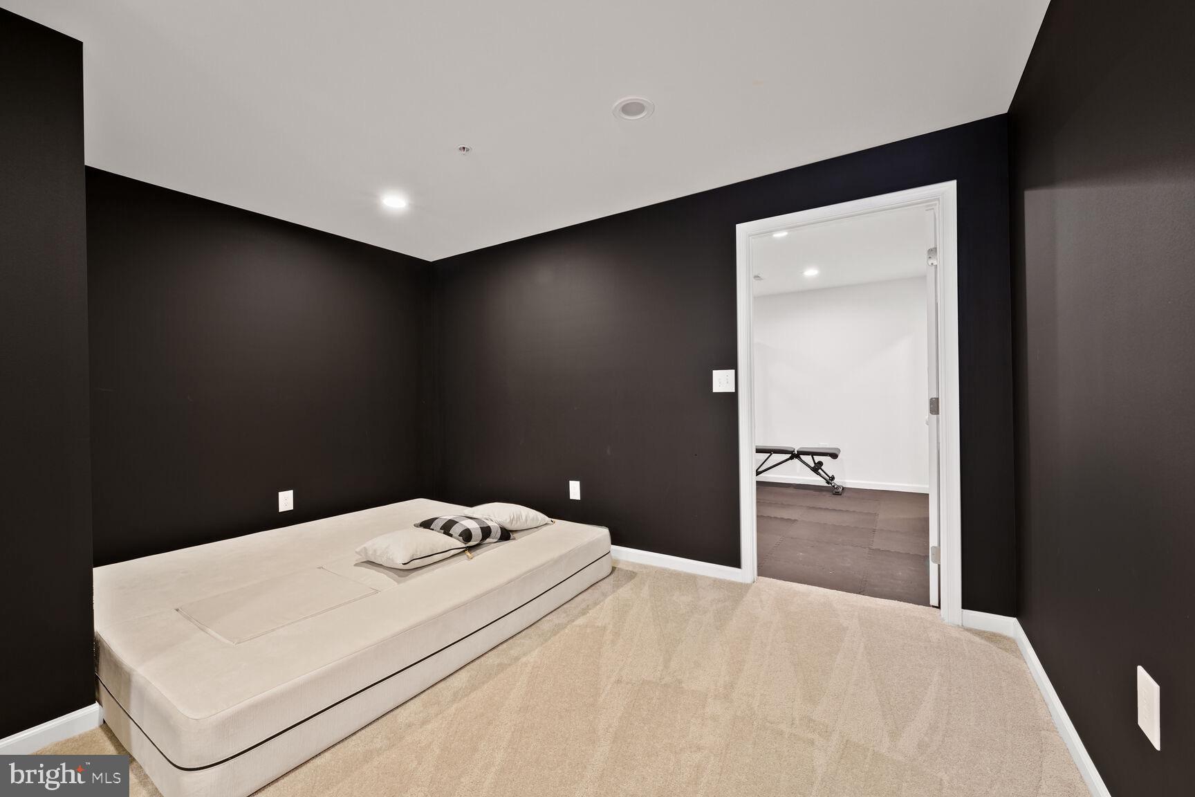 2604 Tree View Way Fort Washington, MD 20744 - Photo 40 of 50 a bedroom with a bed and a large mirror