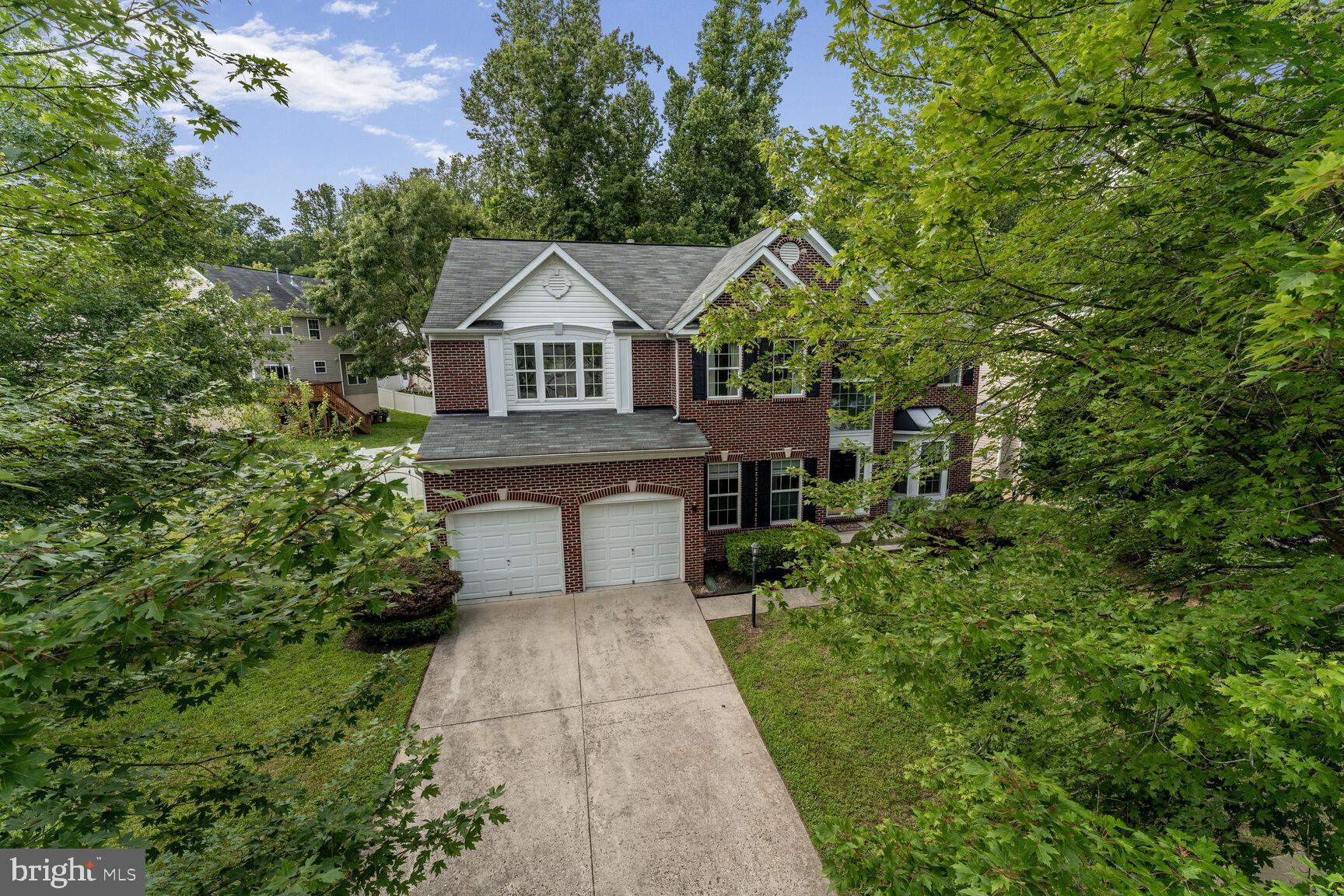 2604 Tree View Way Fort Washington, MD 20744 - Photo 4 of 50 a front view of a house with a yard