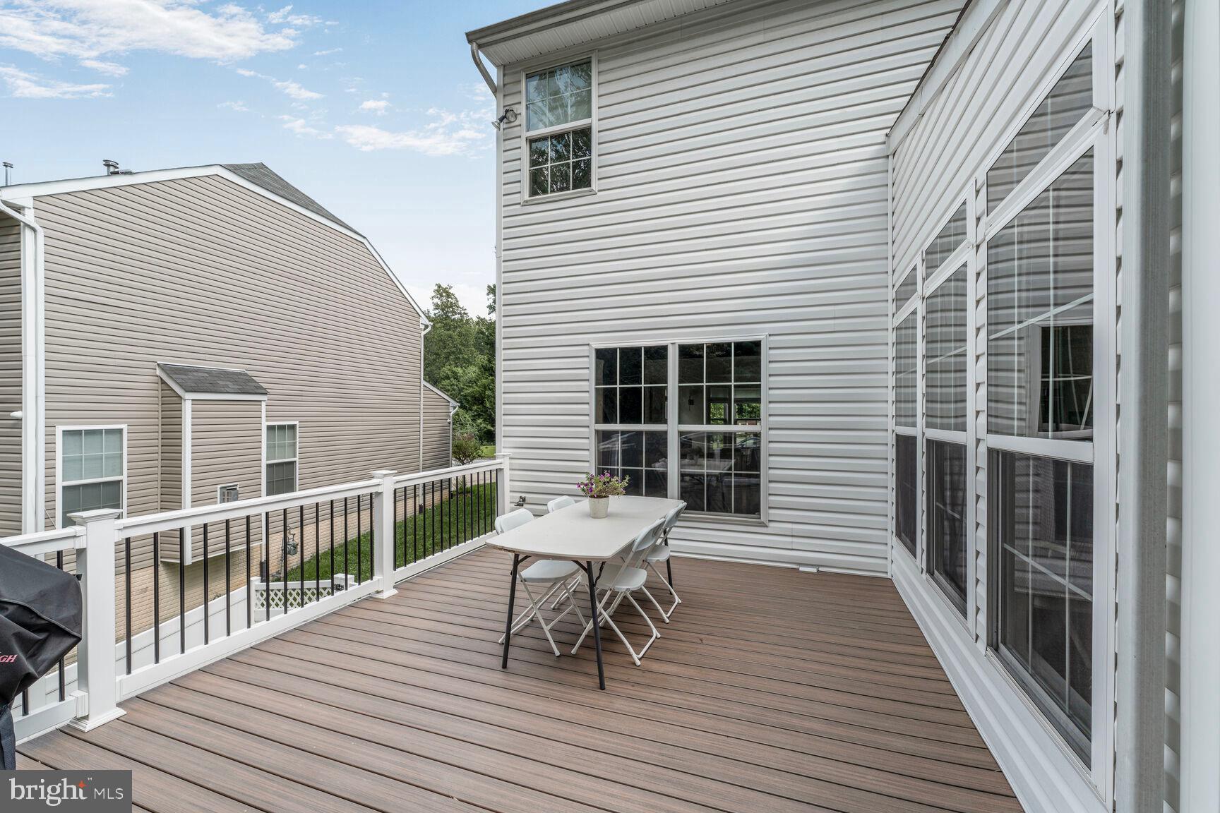 2604 Tree View Way Fort Washington, MD 20744 - Photo 46 of 50 a balcony with wooden floor and furniture