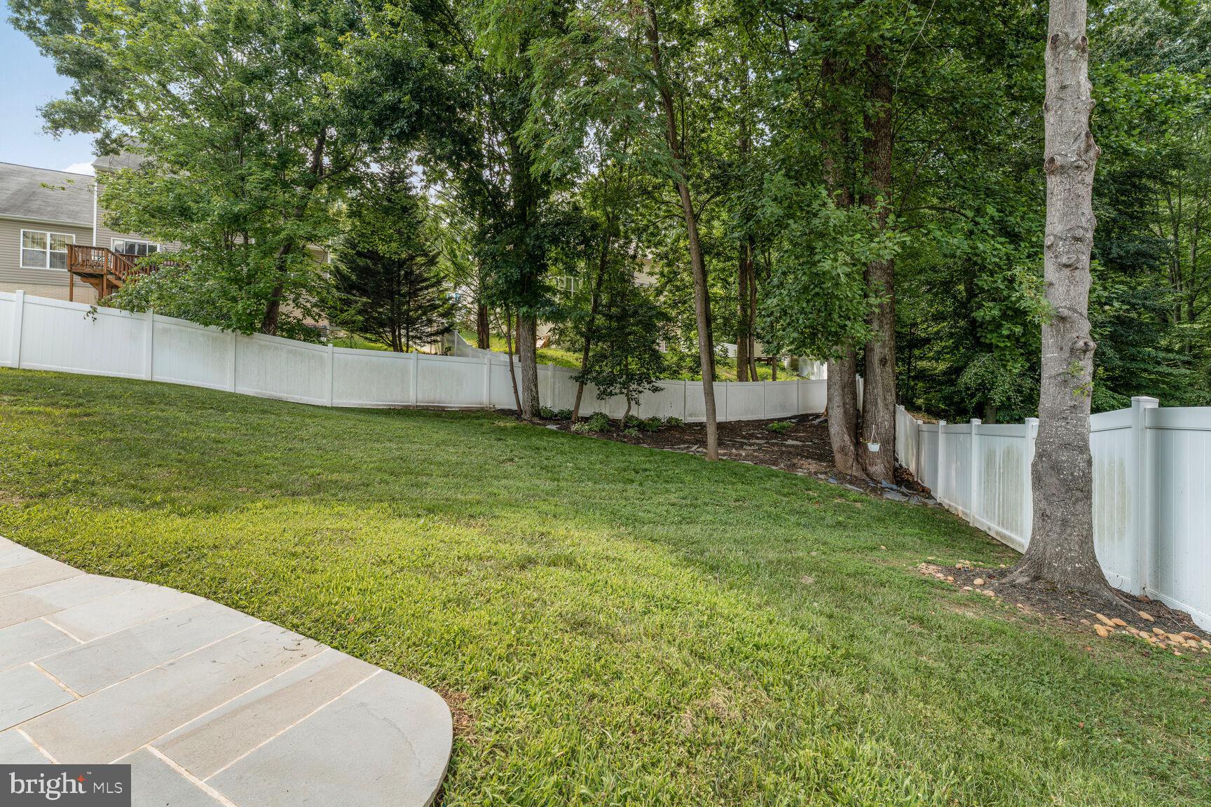 2604 Tree View Way Fort Washington, MD 20744 - Photo 47 of 50 a view of a backyard with large trees