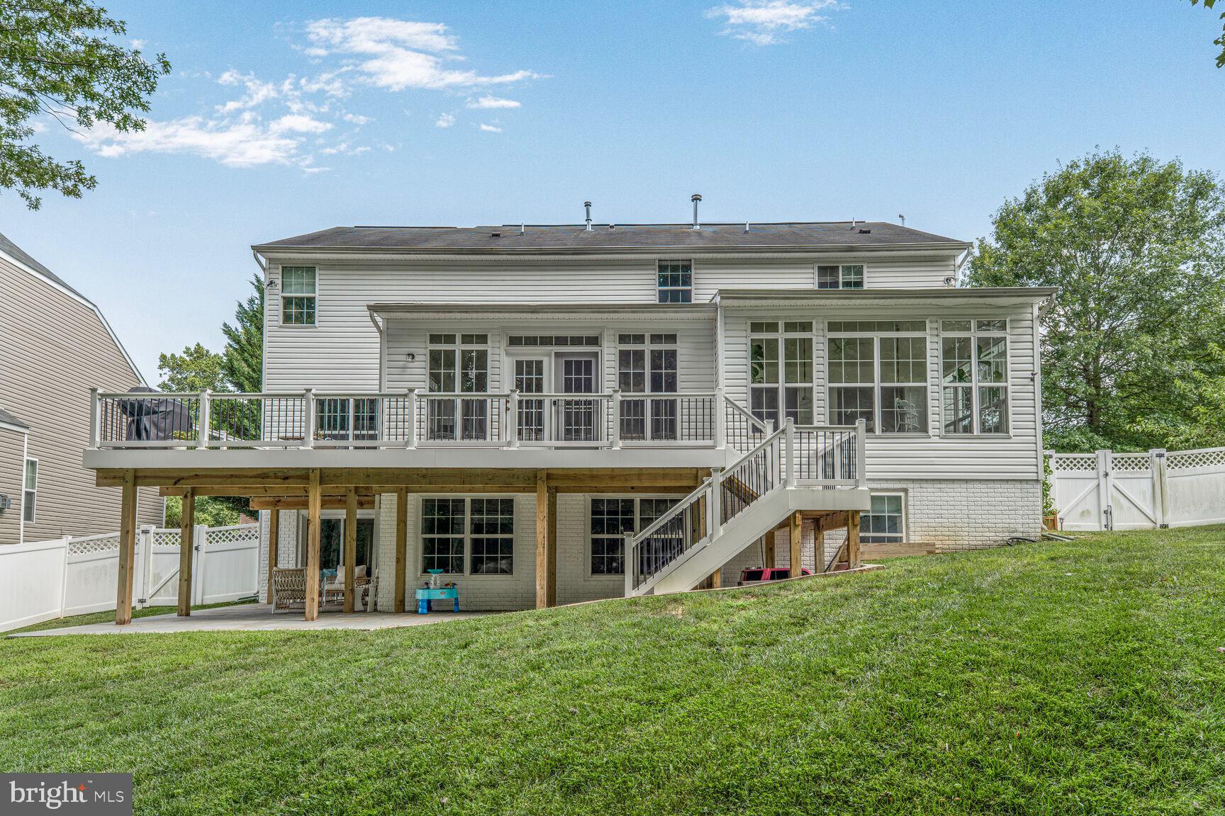 2604 Tree View Way Fort Washington, MD 20744 - Photo 50 of 50 a view of a house with a large window and a yard