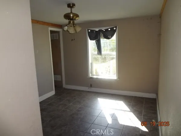 an empty room with wooden floor