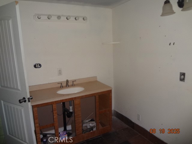 17312 Cache Creek Road Clearlake Oaks, CA 95423 - Photo 20 of 20 a bathroom with a sink and a mirror