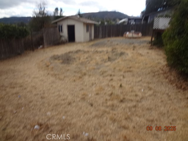 17312 Cache Creek Road Clearlake Oaks, CA 95423 - Photo 6 of 20 a view of a house with a yard