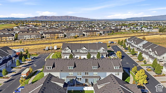 1081 Bowery Way Mapleton, UT 84664 - Photo 41 of 41 Residential community featuring townhomes with attached garages, paved streets, and landscaped common areas