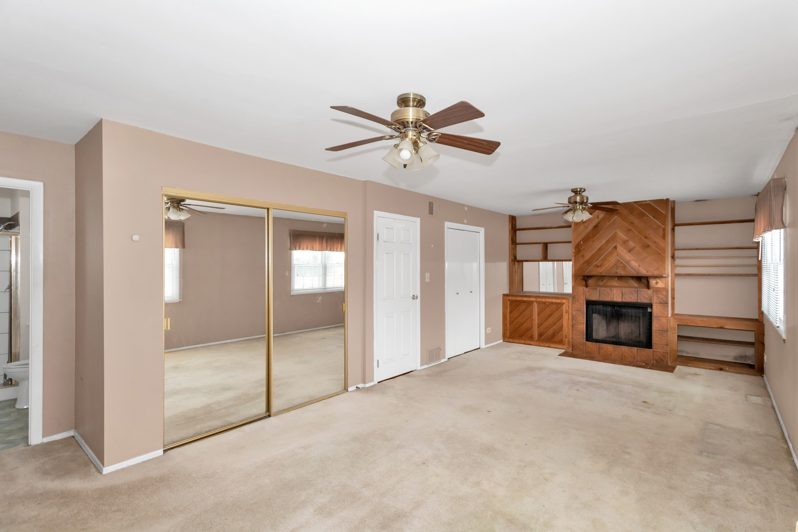 1900 Chippendale Road Hoffman Estates, IL 60169 - Photo 20 of 37 a view of a livingroom with a fireplace and cabinet