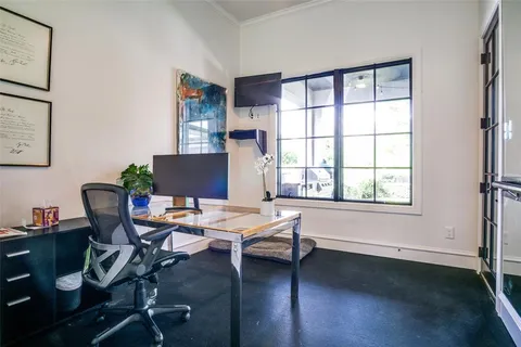 a workspace with furniture hardwood and a window
