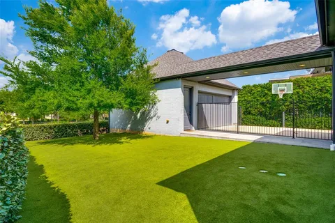 a view of a house with swimming pool and a yard