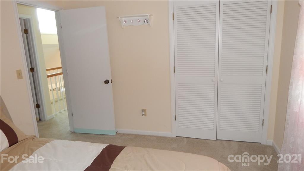 1020 Old Stonecutter Road Rutherfordton, NC 28139 - Photo 22 of 39 a bedroom with a bed and a mirror