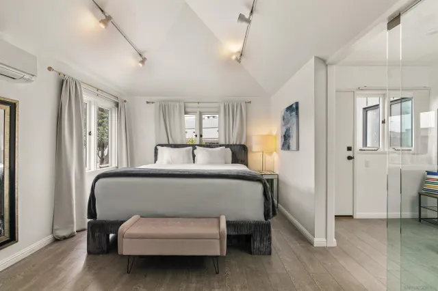 a bedroom with furniture and a window