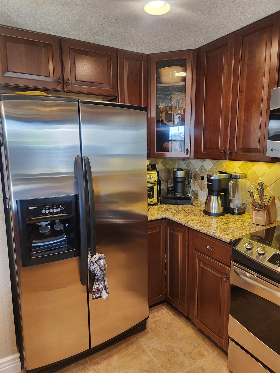 777 Jordanolo Drive Ripon, CA 95366 - Photo 20 of 61 a kitchen with a refrigerator and a sink
