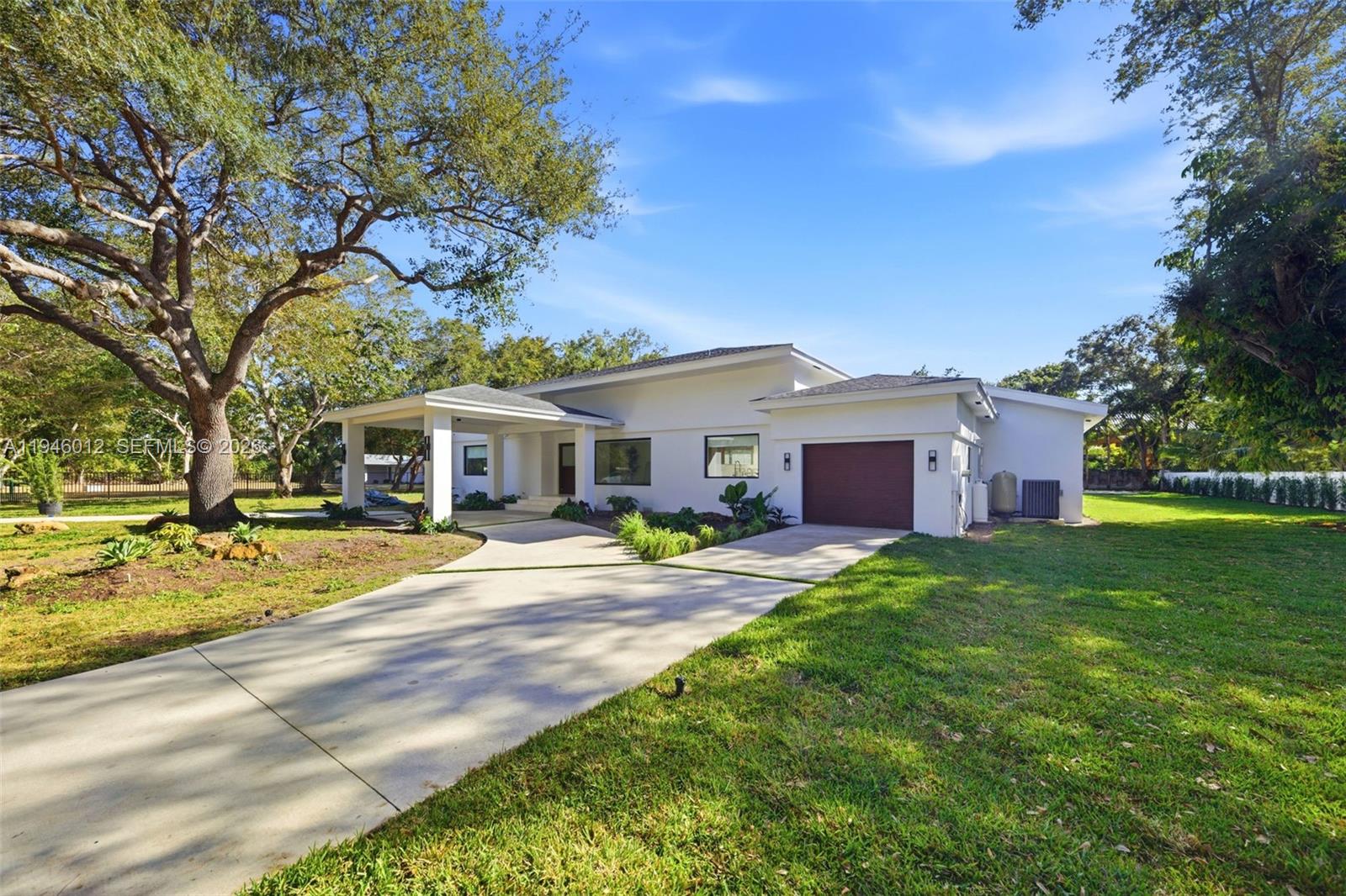 8800 Southwest 118th Street Miami, FL 33176 - Photo 1 of 44 a view of a house with a big yard and large trees