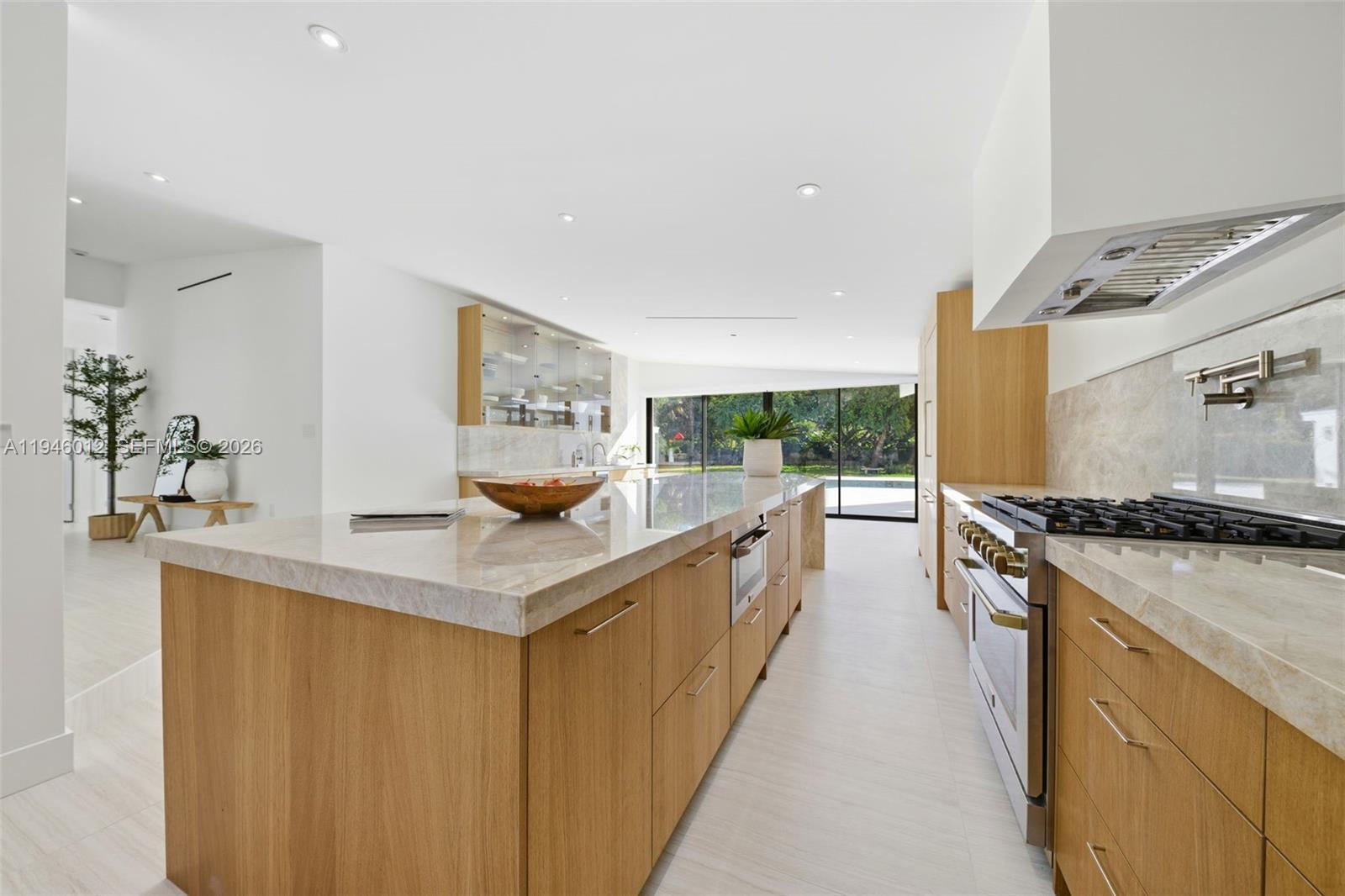 8800 Southwest 118th Street Miami, FL 33176 - Photo 20 of 44 a kitchen with stainless steel appliances granite countertop a stove a sink and a refrigerator