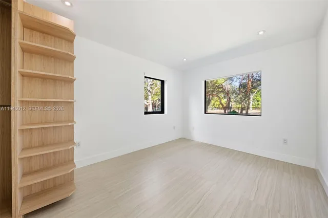 wooden floor and windows in an empty room