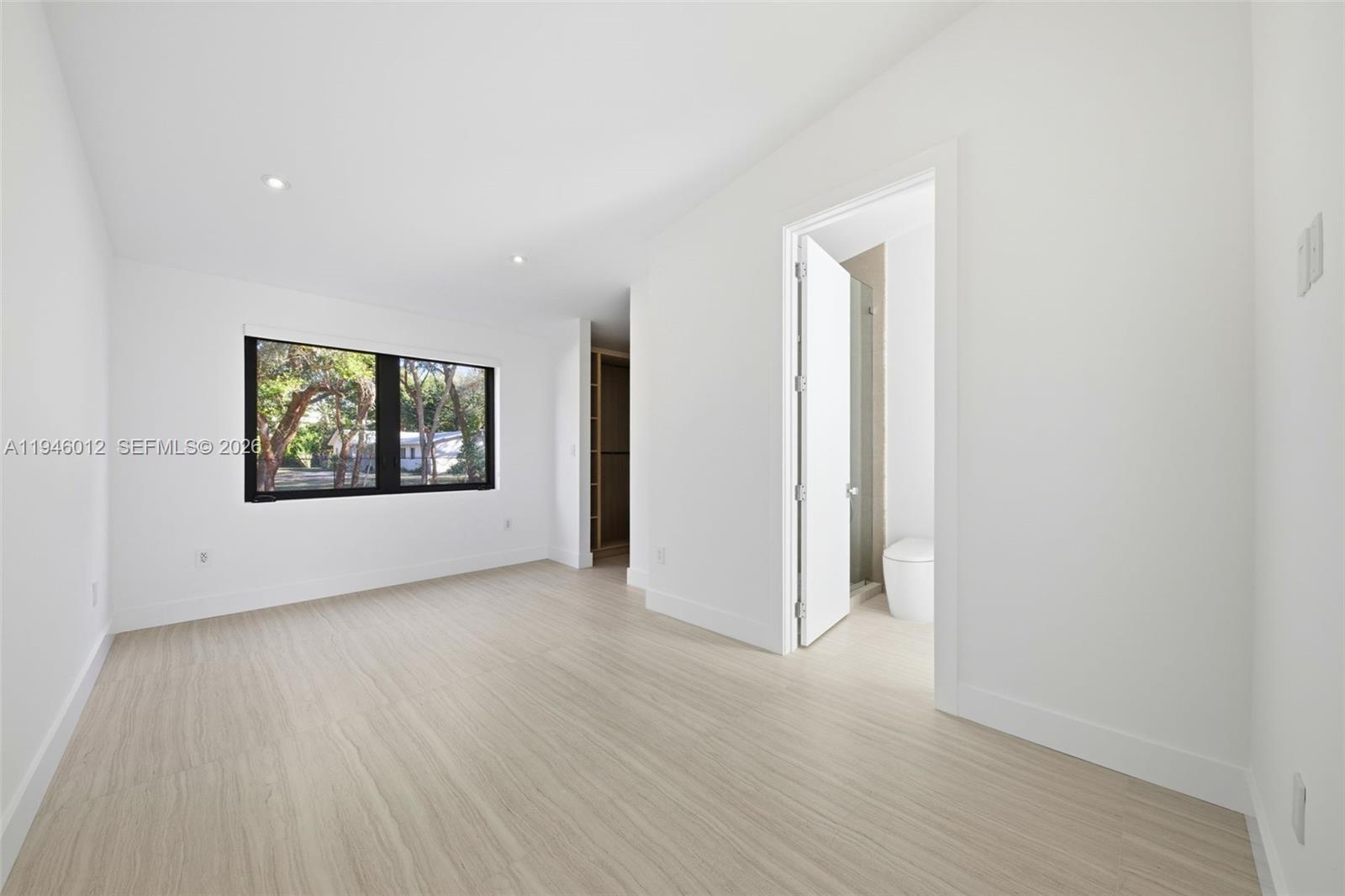 8800 Southwest 118th Street Miami, FL 33176 - Photo 27 of 44 an empty room with wooden floor and windows