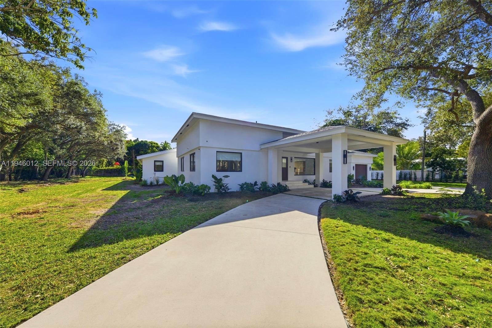 8800 Southwest 118th Street Miami, FL 33176 - Photo 3 of 44 a front view of a house with garden and porch