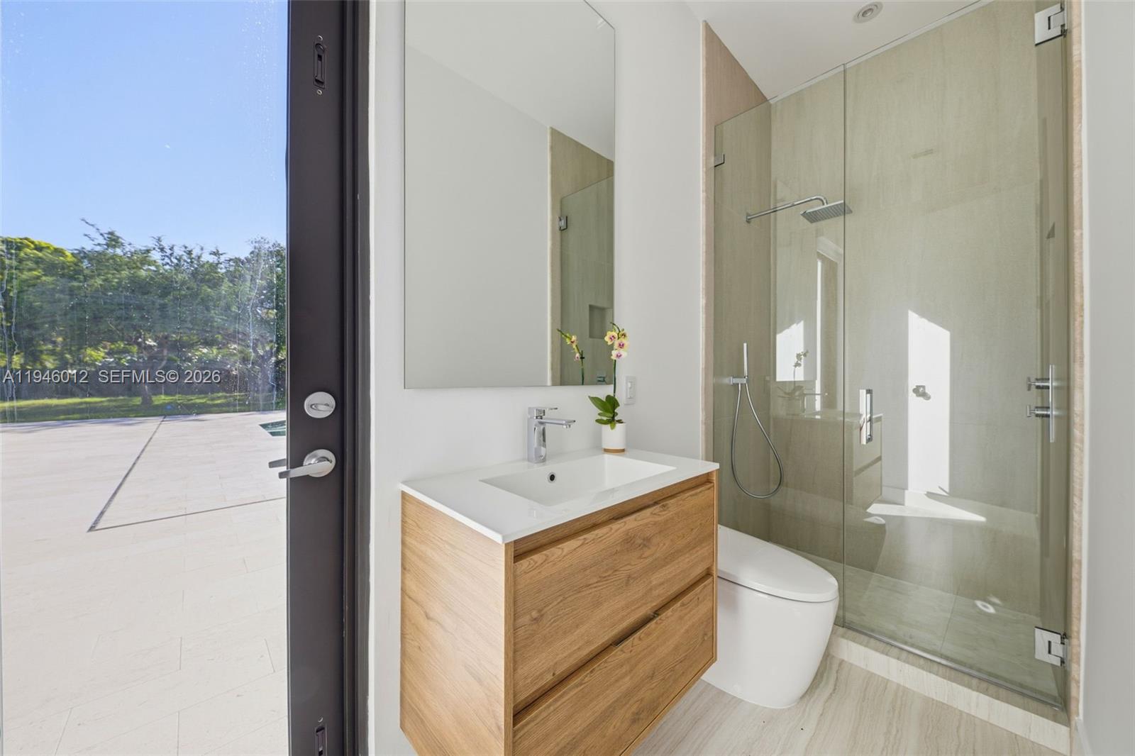 8800 Southwest 118th Street Miami, FL 33176 - Photo 39 of 44 a bathroom with a sink a toilet a mirror and shower