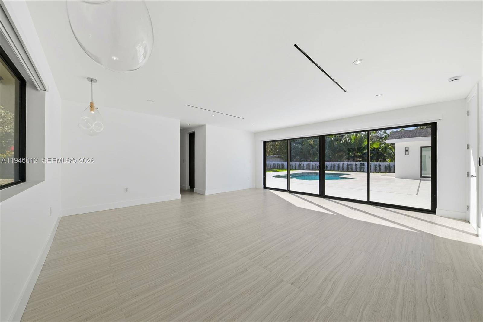 8800 Southwest 118th Street Miami, FL 33176 - Photo 7 of 44 a view of an empty room with a window