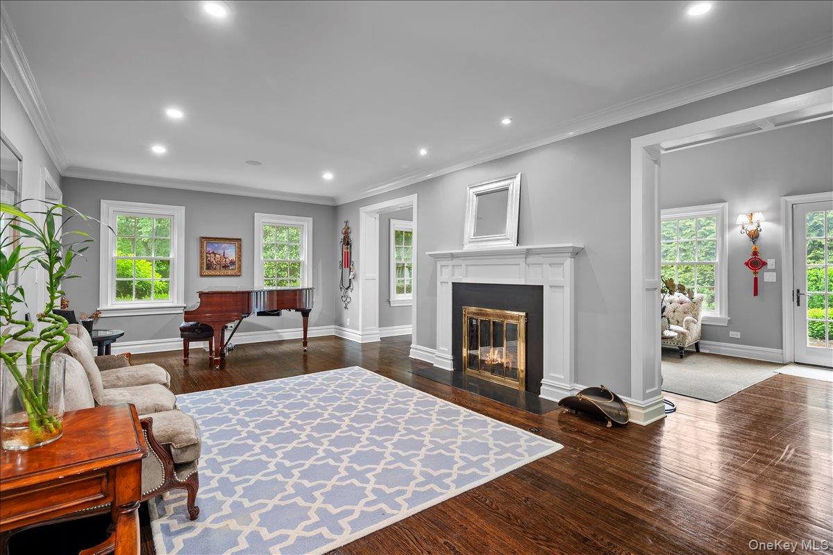7 Harcourt Road Scarsdale, NY 10583 - Photo 11 of 34 a living room with furniture and a fireplace