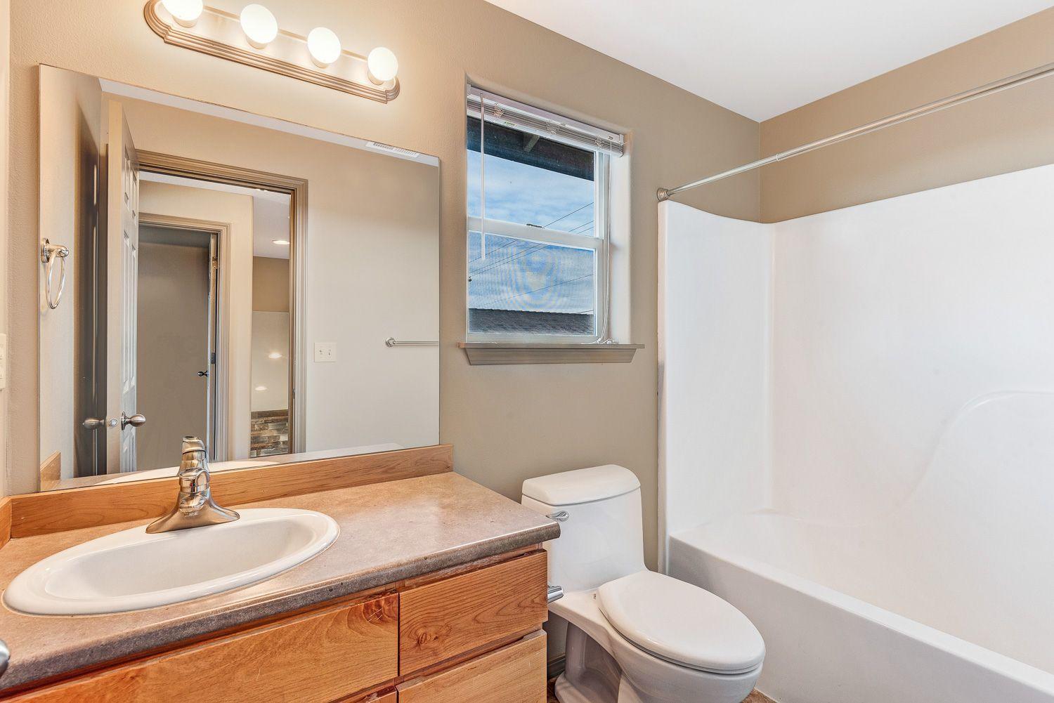 63335 Vogt Road Bend, OR 97701 - Photo 13 of 20 a bathroom with a sink a toilet and shower