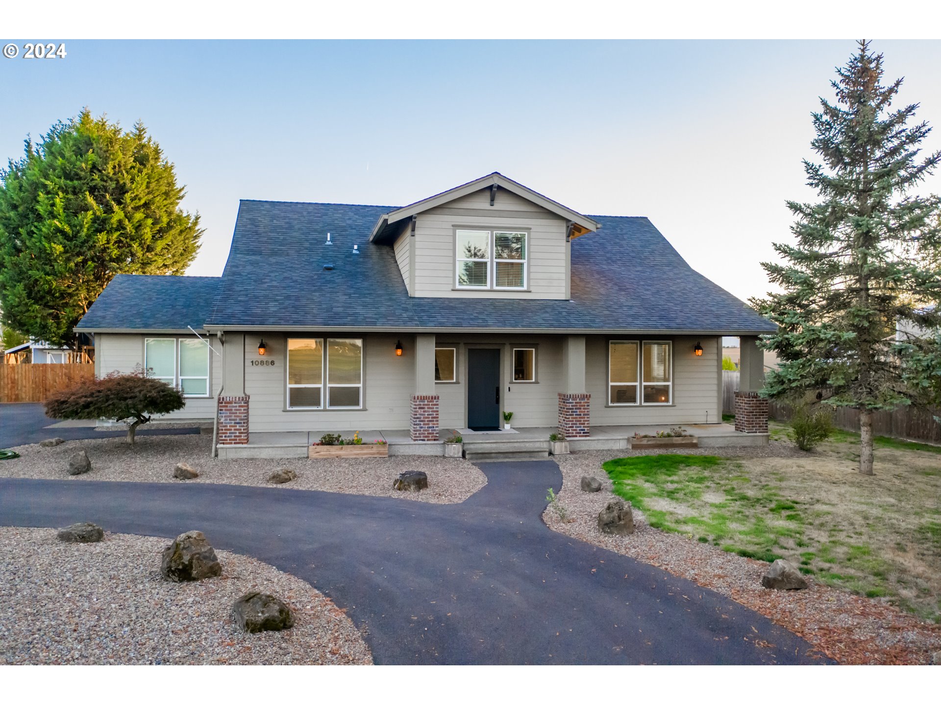 10886 Bethel Road Amity, OR 97101 - Photo 1 of 42 a front view of a house with patio