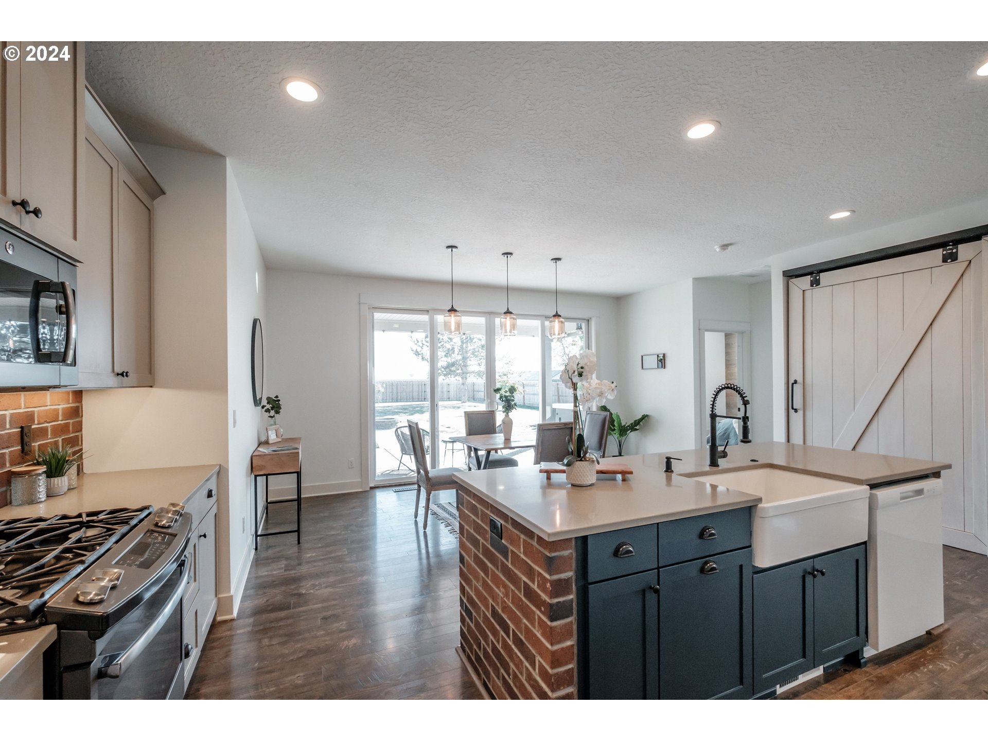 10886 Bethel Road Amity, OR 97101 - Photo 13 of 42 a kitchen with a sink stove and cabinets