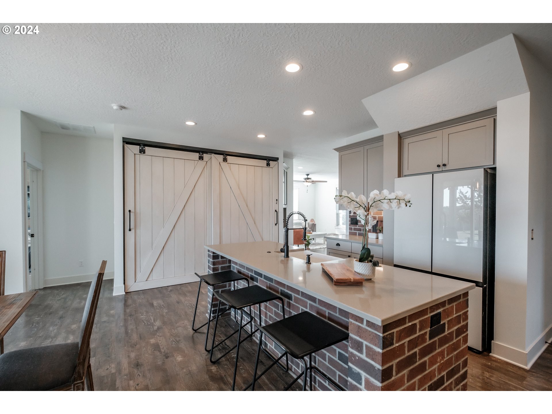10886 Bethel Road Amity, OR 97101 - Photo 14 of 42 a kitchen with a table chairs refrigerator and cabinets