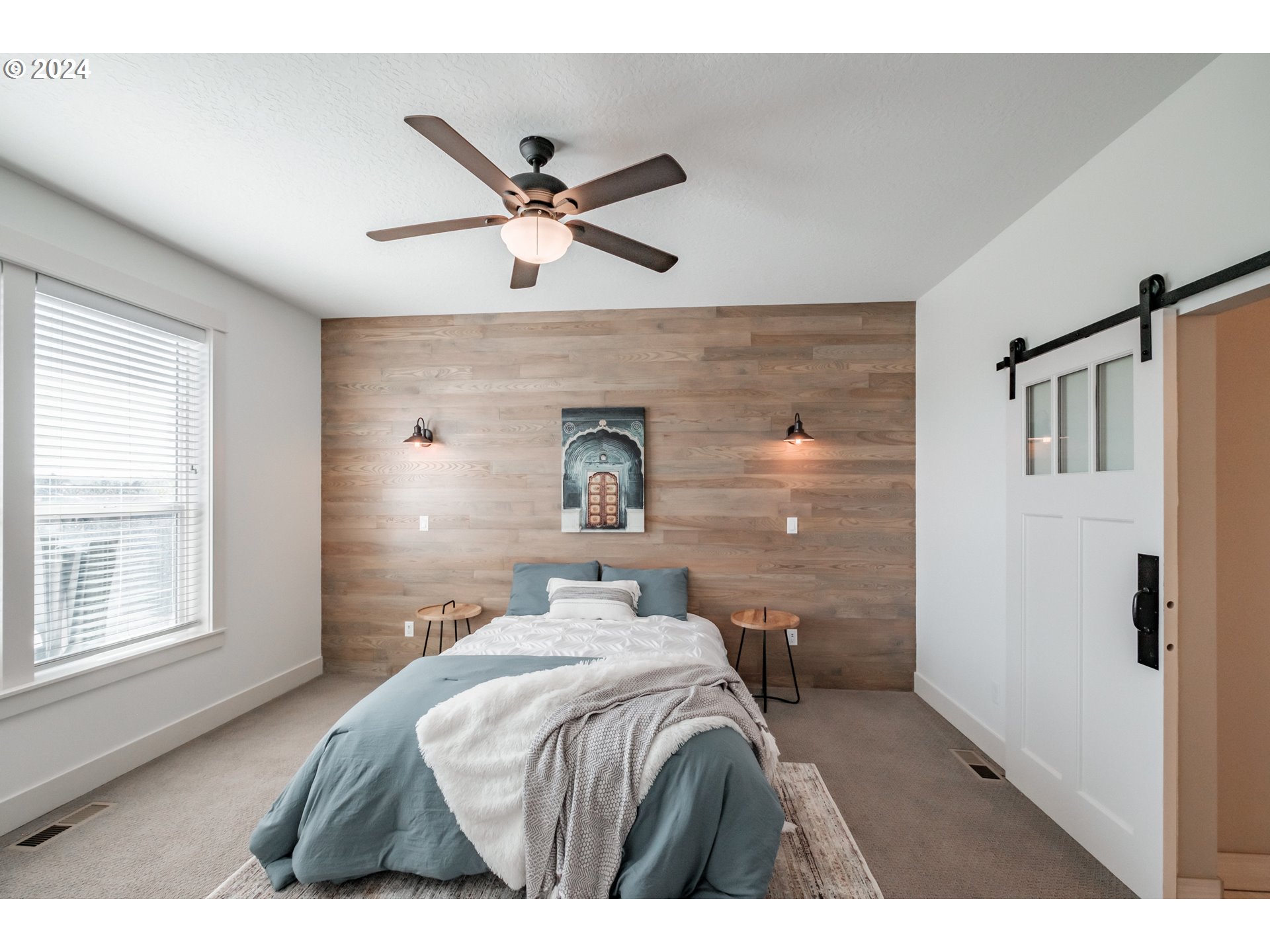10886 Bethel Road Amity, OR 97101 - Photo 20 of 42 a bedroom with a bed and a chandelier