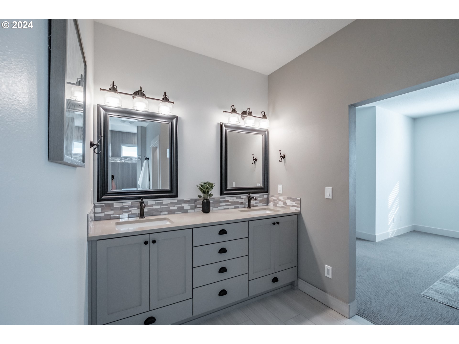 10886 Bethel Road Amity, OR 97101 - Photo 25 of 42 a bathroom with a double vanity sink and mirror