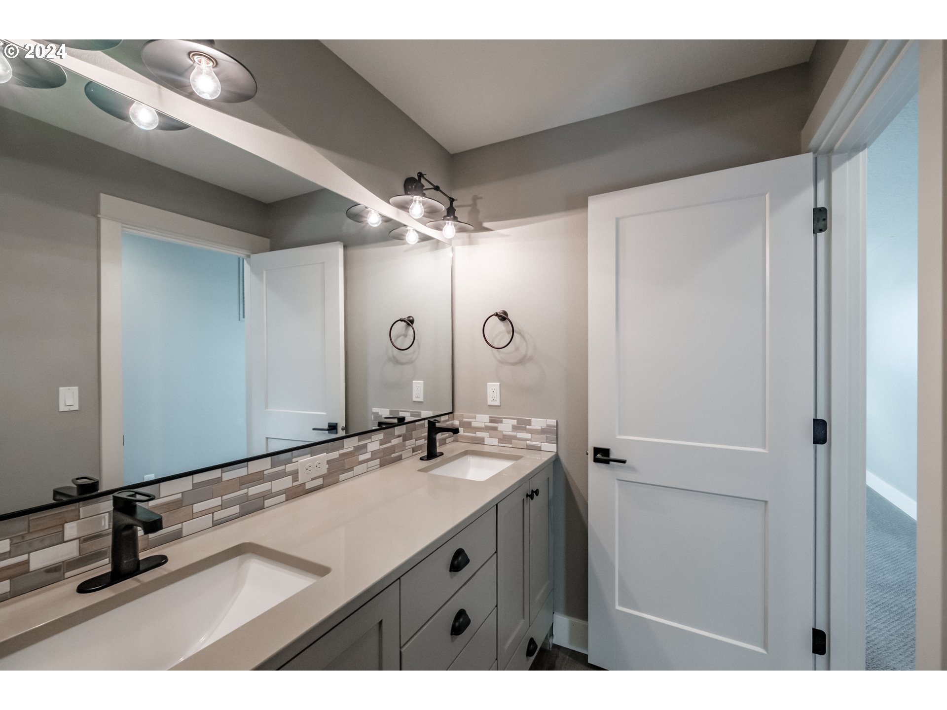 10886 Bethel Road Amity, OR 97101 - Photo 38 of 42 a bathroom with a sink double vanity and a mirror