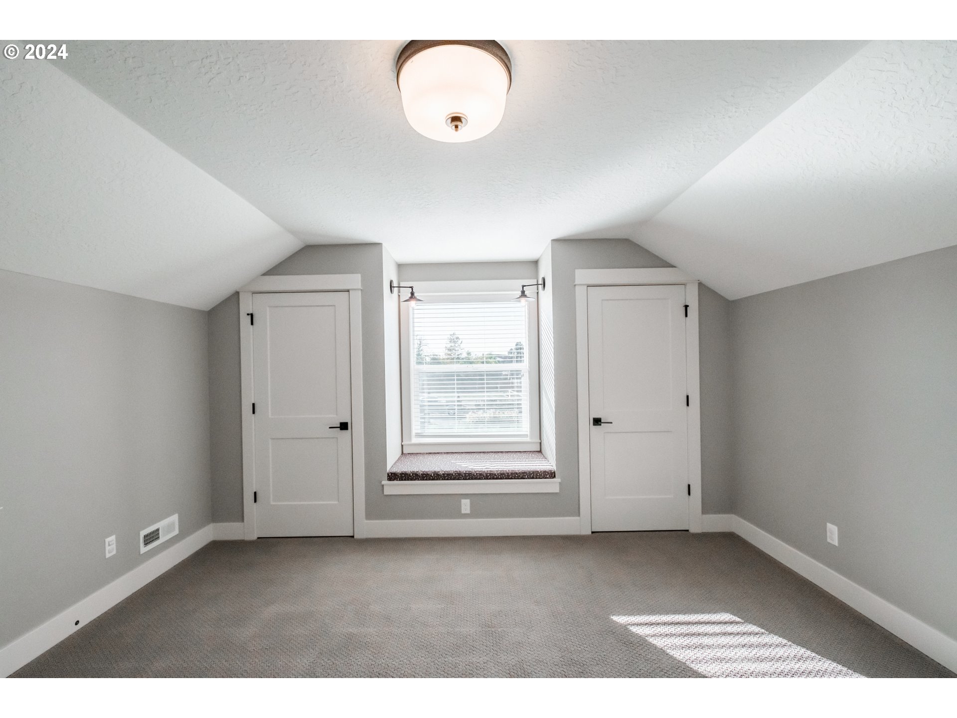 10886 Bethel Road Amity, OR 97101 - Photo 39 of 42 a view of an empty room with a window and wooden floor