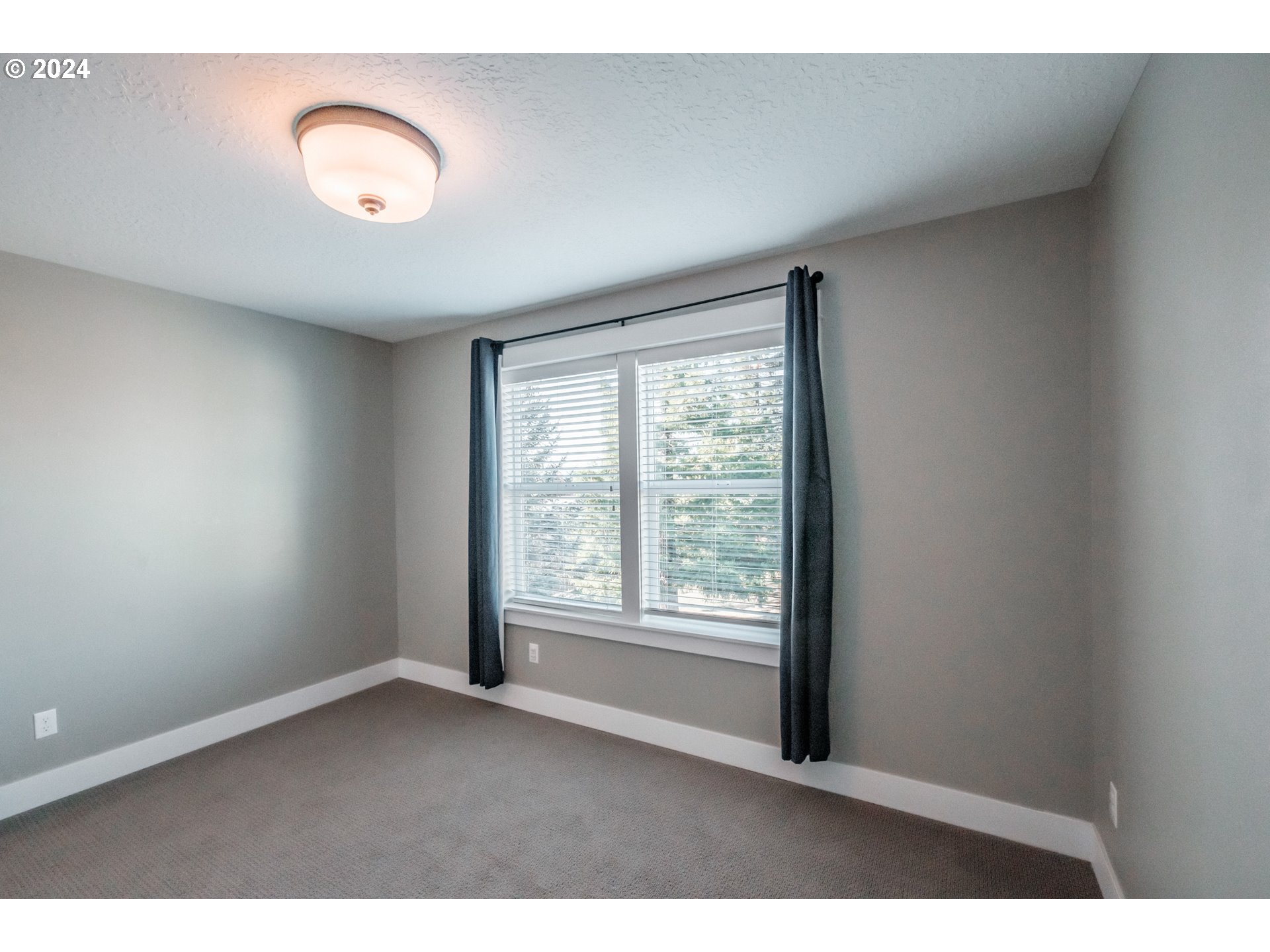 10886 Bethel Road Amity, OR 97101 - Photo 41 of 42 a view of an empty room with wooden floor and a window