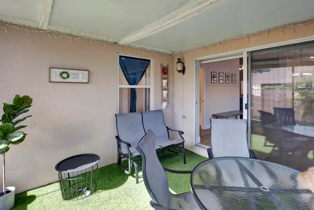 a living room with furniture and a chair