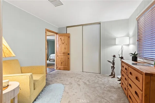 a bathroom with a double vanity sink toilet and shower