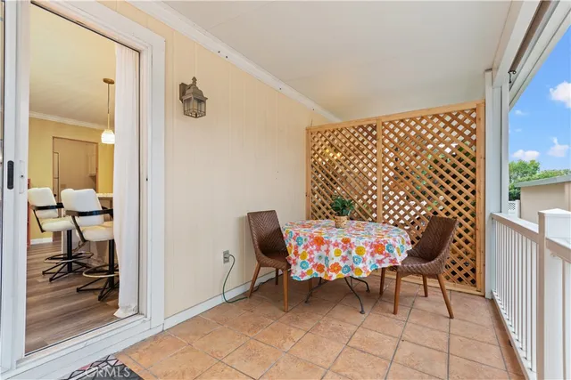 a view of a chairs and bench in the backyard