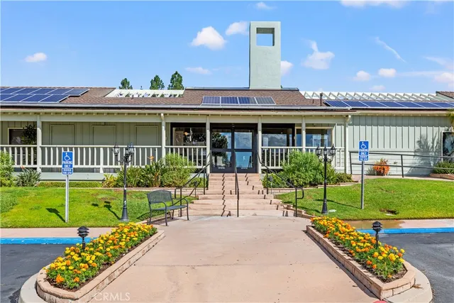 a view of a chairs and table in patio with a garden